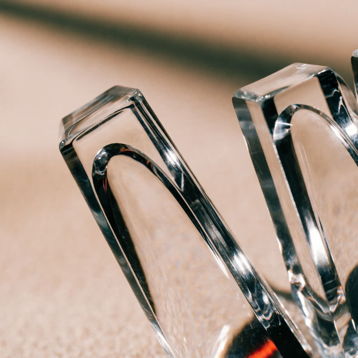Faceted glass forms catching soft directional light